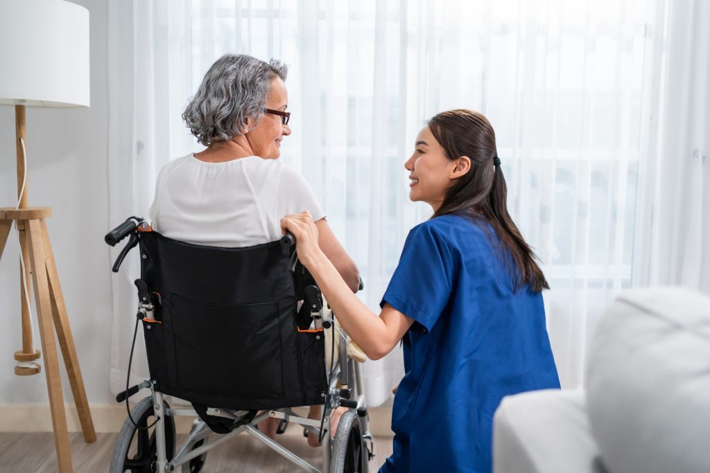 caucasian-senior-woman-sit-on-wheelchair-with-youn-2026-01-09-07-21-21-utc-large